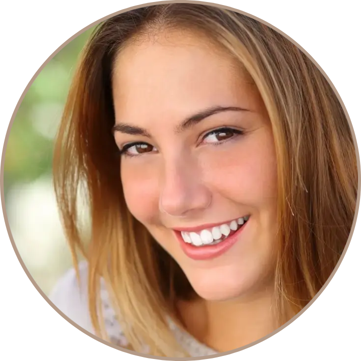 A woman with long hair smiles for the camera.